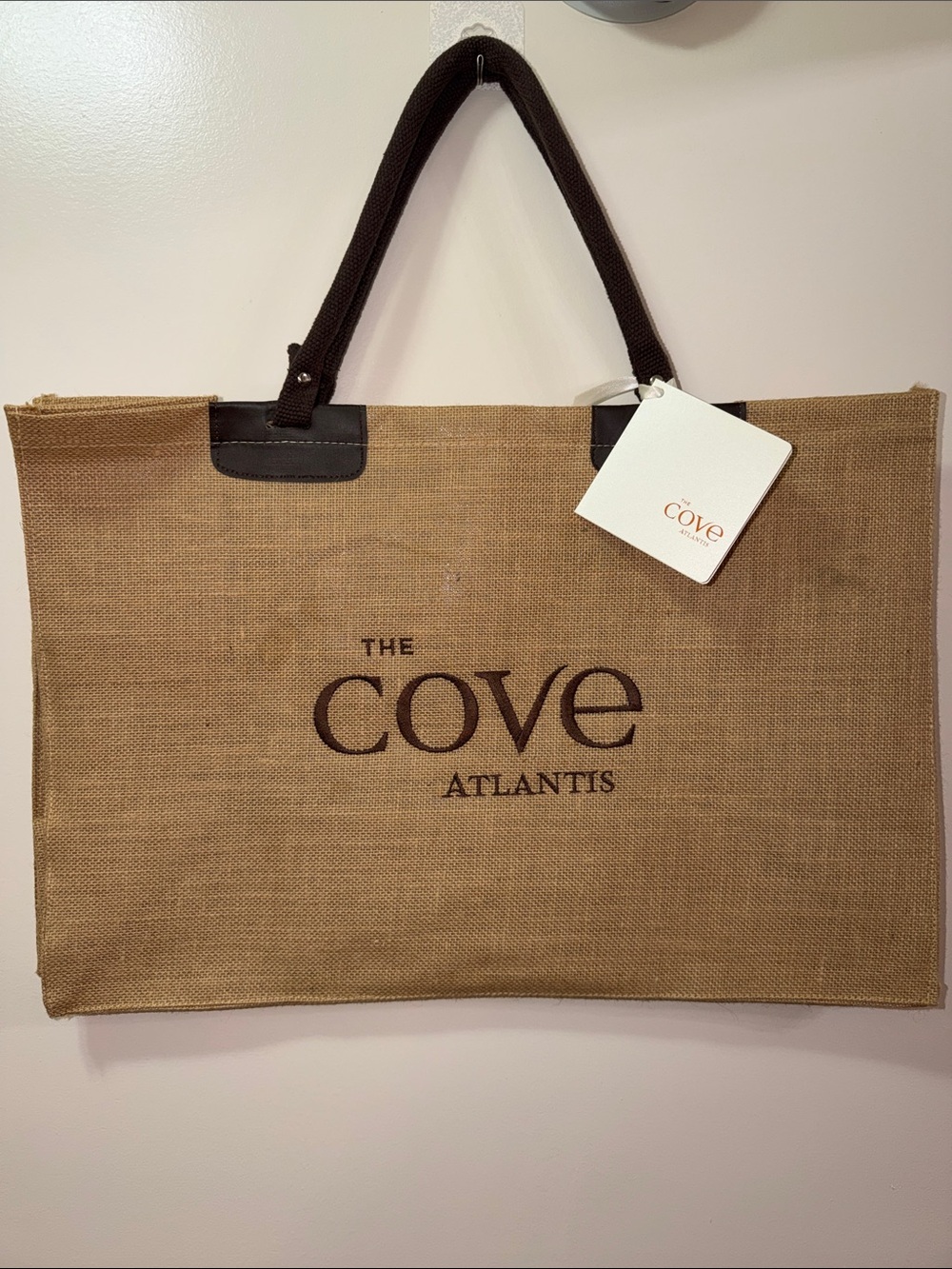 Cove Atlantis Paradise Island Natural Jute Tote with Dark Brown Handles.